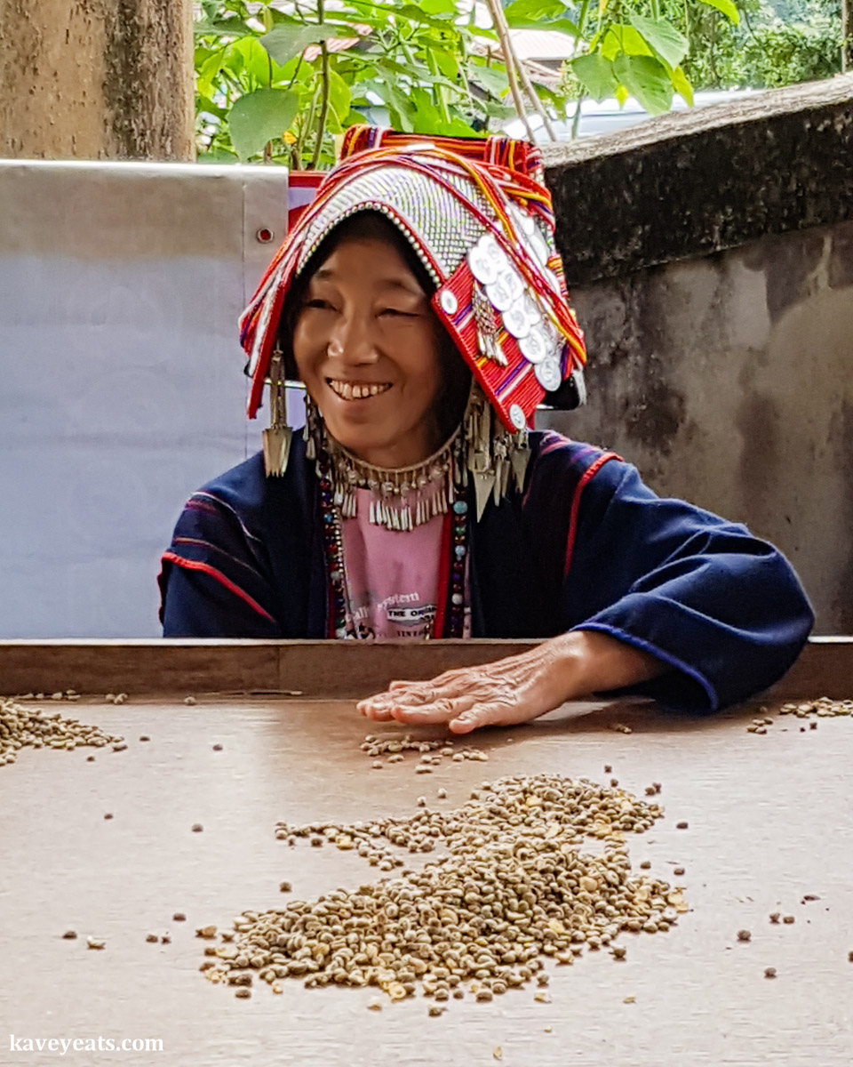 An Akha woman in traditional dress and headgear, during a two day visit to the Akha Hill Tribe of Thailand's Doi Pha Mee, on Kavey Eats