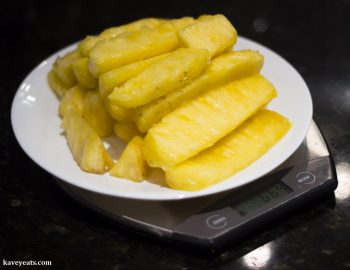 Weighing fresh pineapple to make a pineapple jam filling