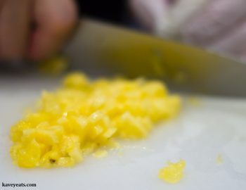 Chopping fresh pineapple to make a pineapple jam filling