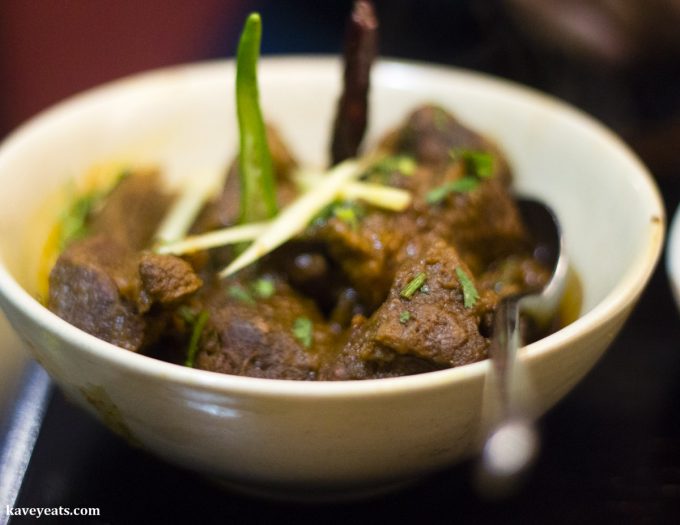Kalighater Kosha Mangsho, a goat meat curry in a rich, tomato-based sauce, at Little Kolkata